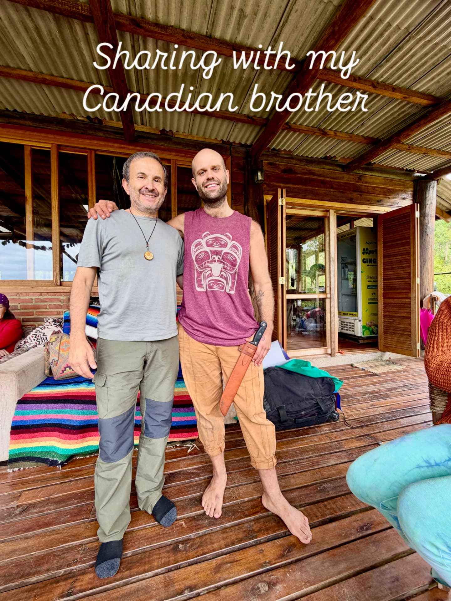 Max Mello with a guest on the deck of a retreat property