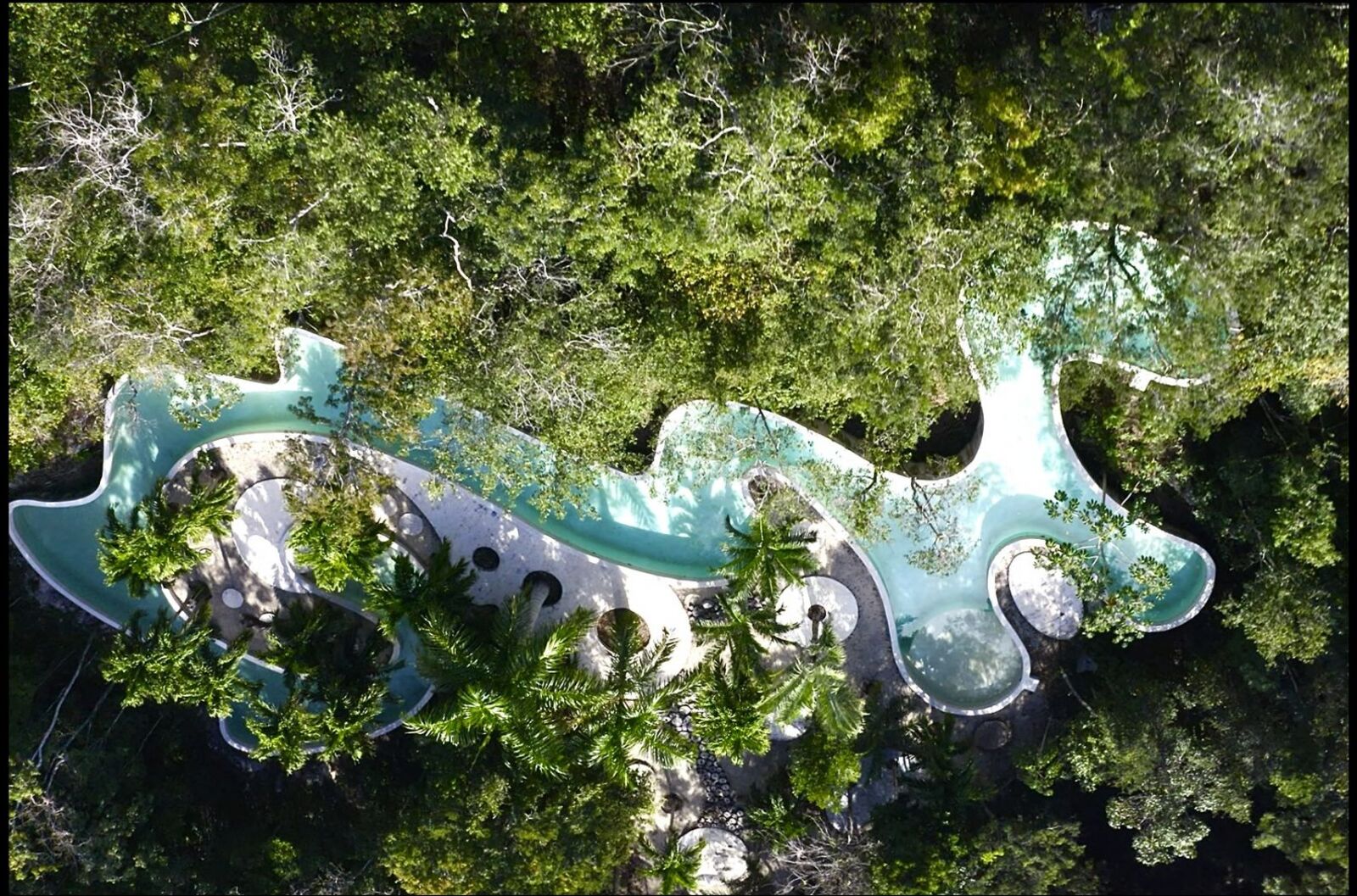 The winding Zorba Zing pool seen from above, framed by jungle